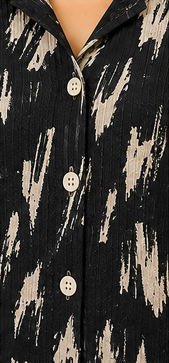Close-up of the black and off-white abstract print on crinkled cotton