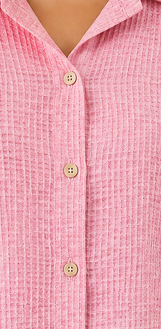 Close-up of the pastel pink fabric and button closure on the Pastel Pink Co-ord Set