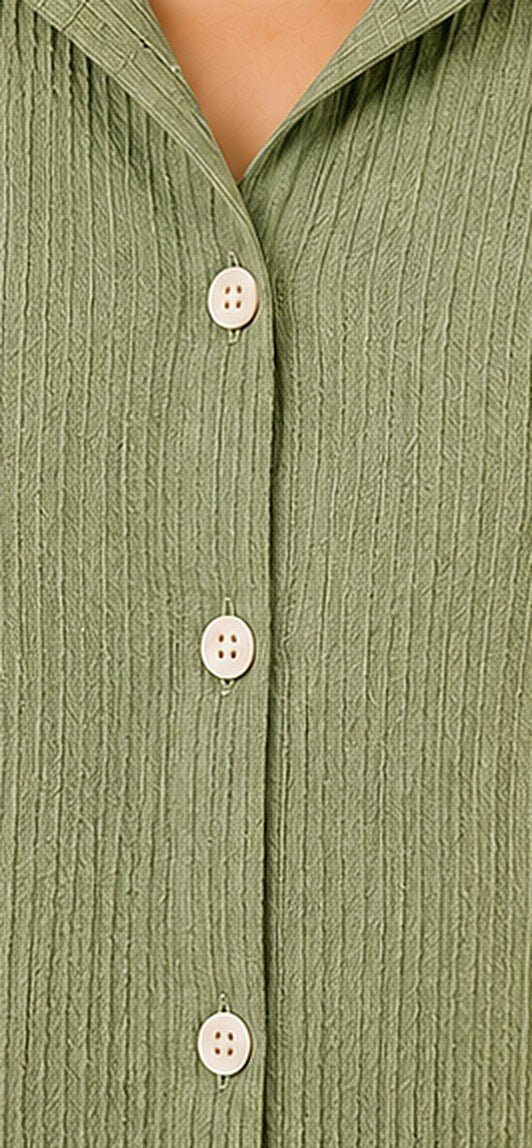 Close-up of the crinkled cotton fabric and button cuff on the Sage Green Co-ord Set